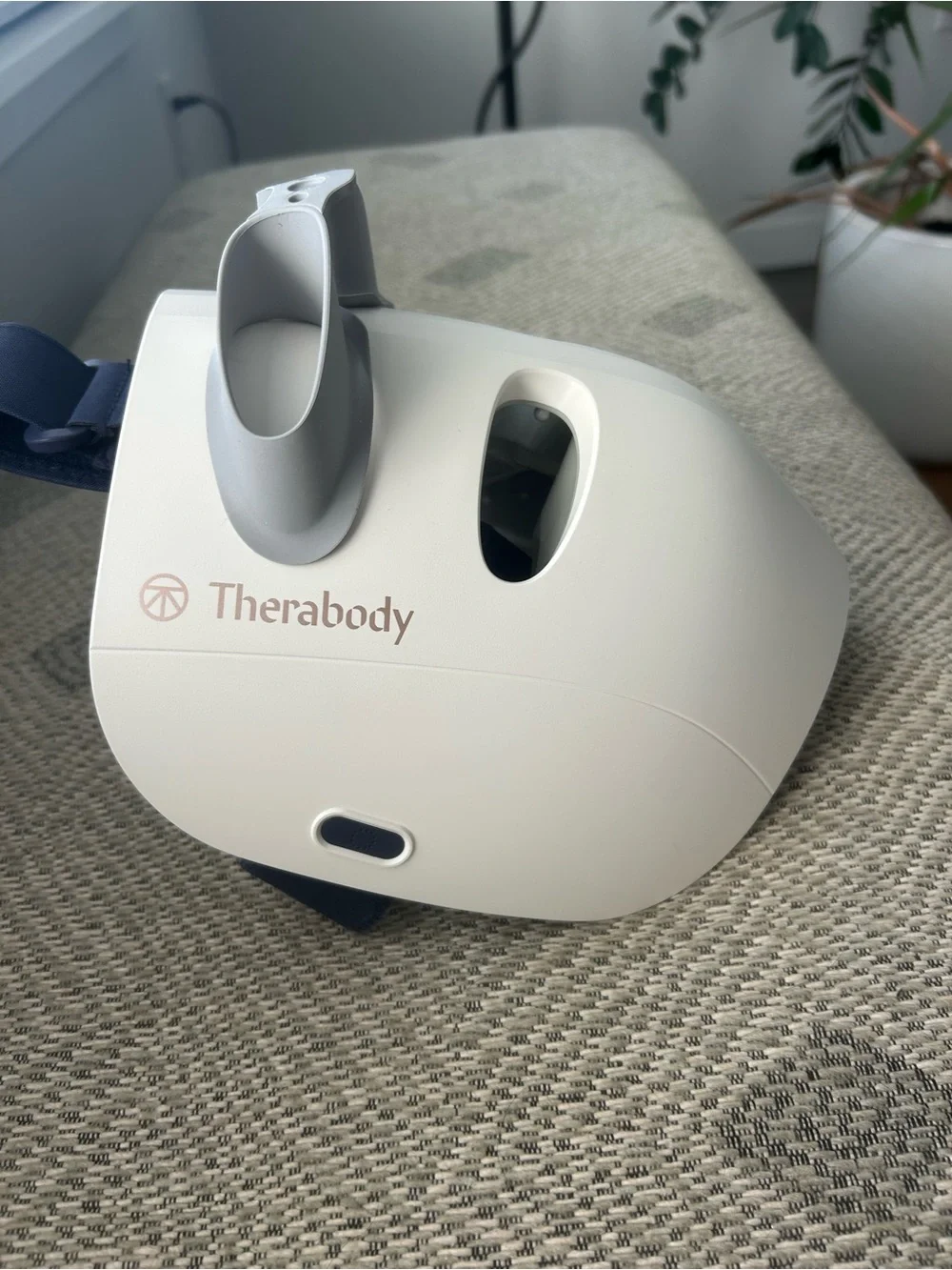 Therabody LED Facial Mask in White with Gray Accents and Navy Strap